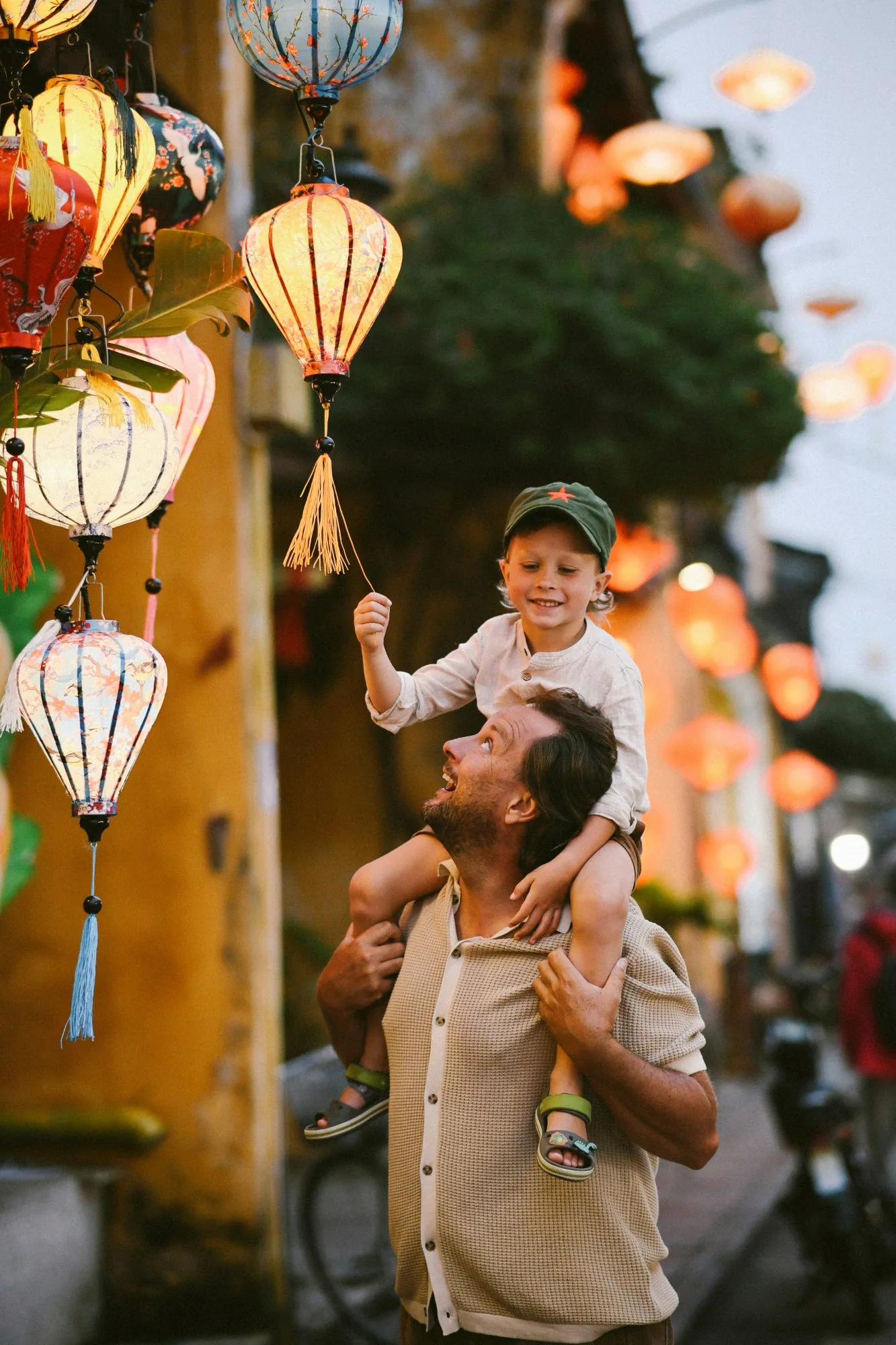 Father and child among lanterns