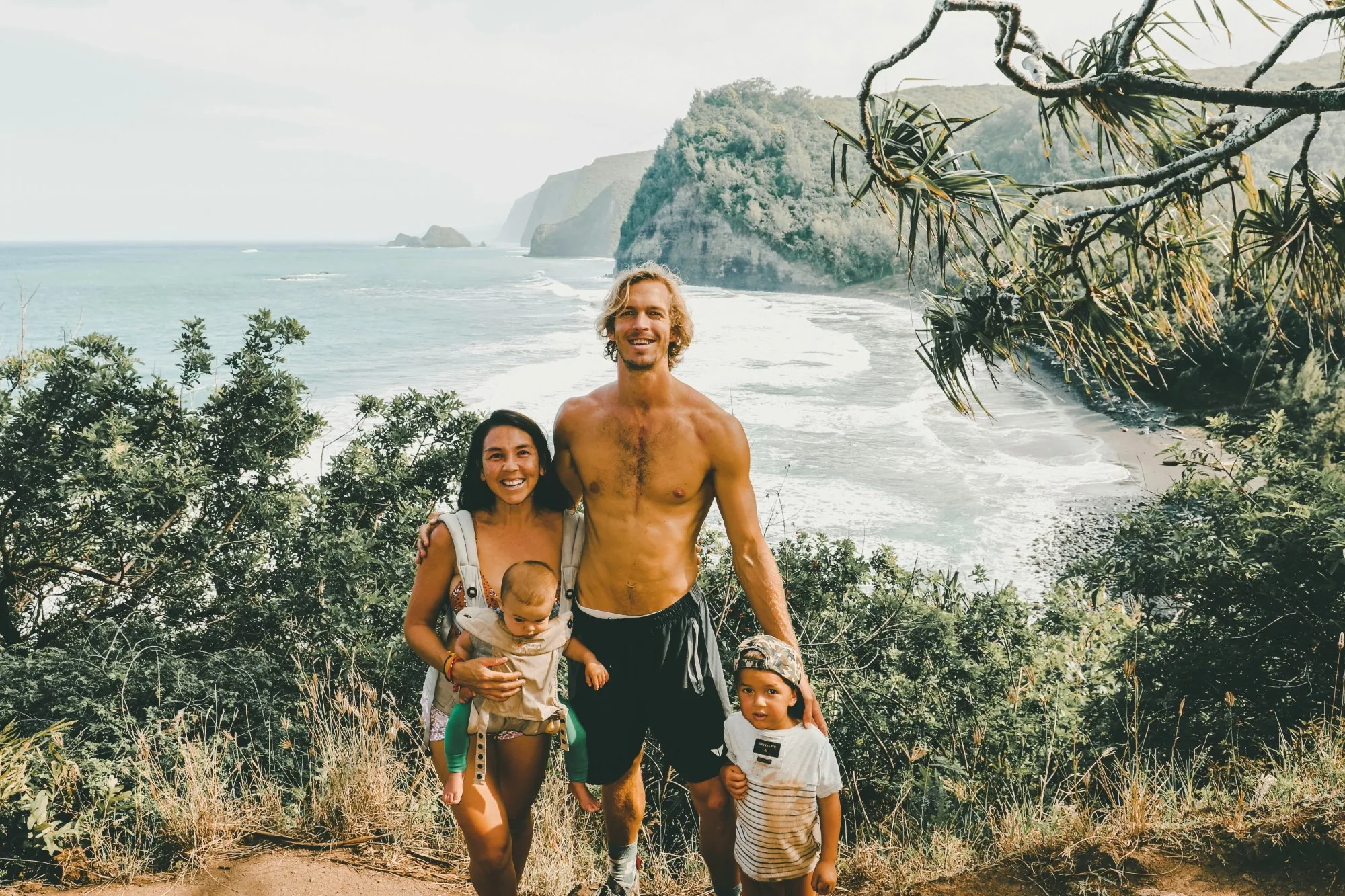 Young family on coastal cliff
